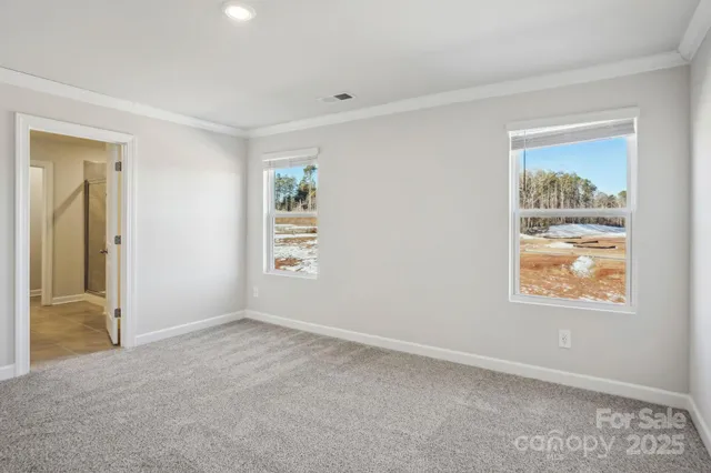 an empty room with a bathroom