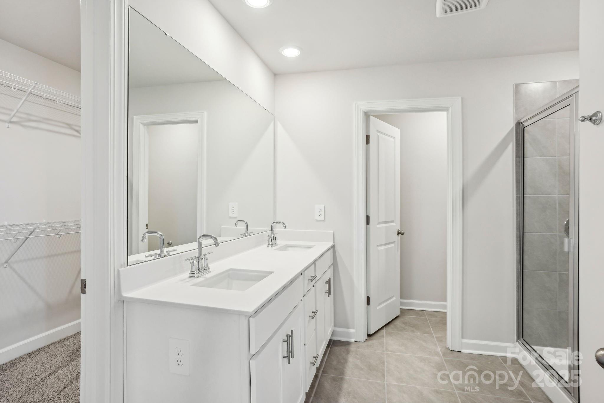 1265 30th St Lane Northeast Conover, NC 28613 - Photo 22 of 24 a bathroom with a double vanity sink and mirror