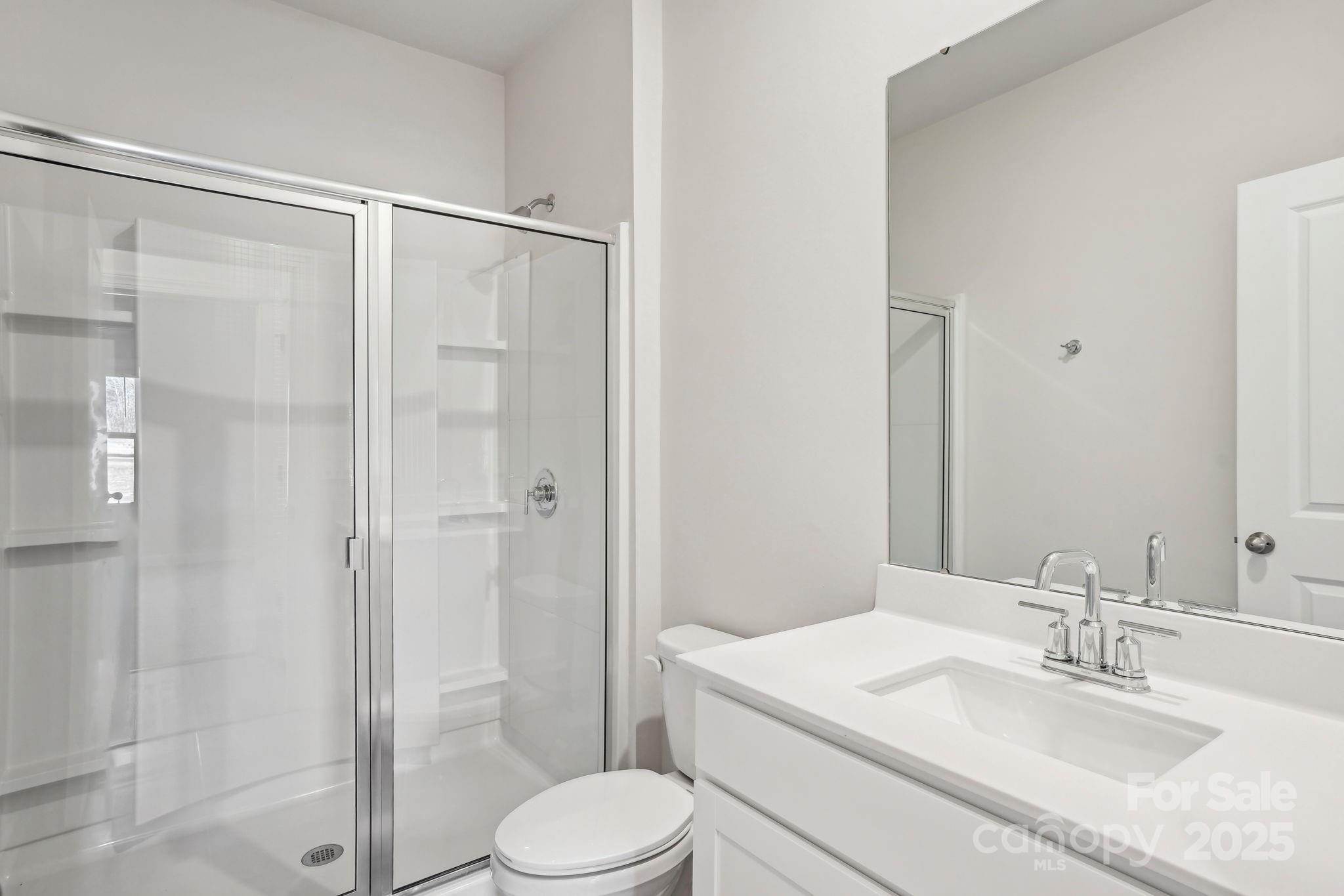 1265 30th St Lane Northeast Conover, NC 28613 - Photo 7 of 24 a bathroom with a granite countertop sink toilet and shower