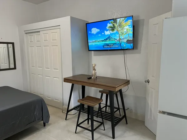 a bedroom with a bed and a table in it