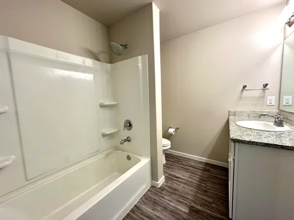 a bathroom with a bathtub a sink and a toilet