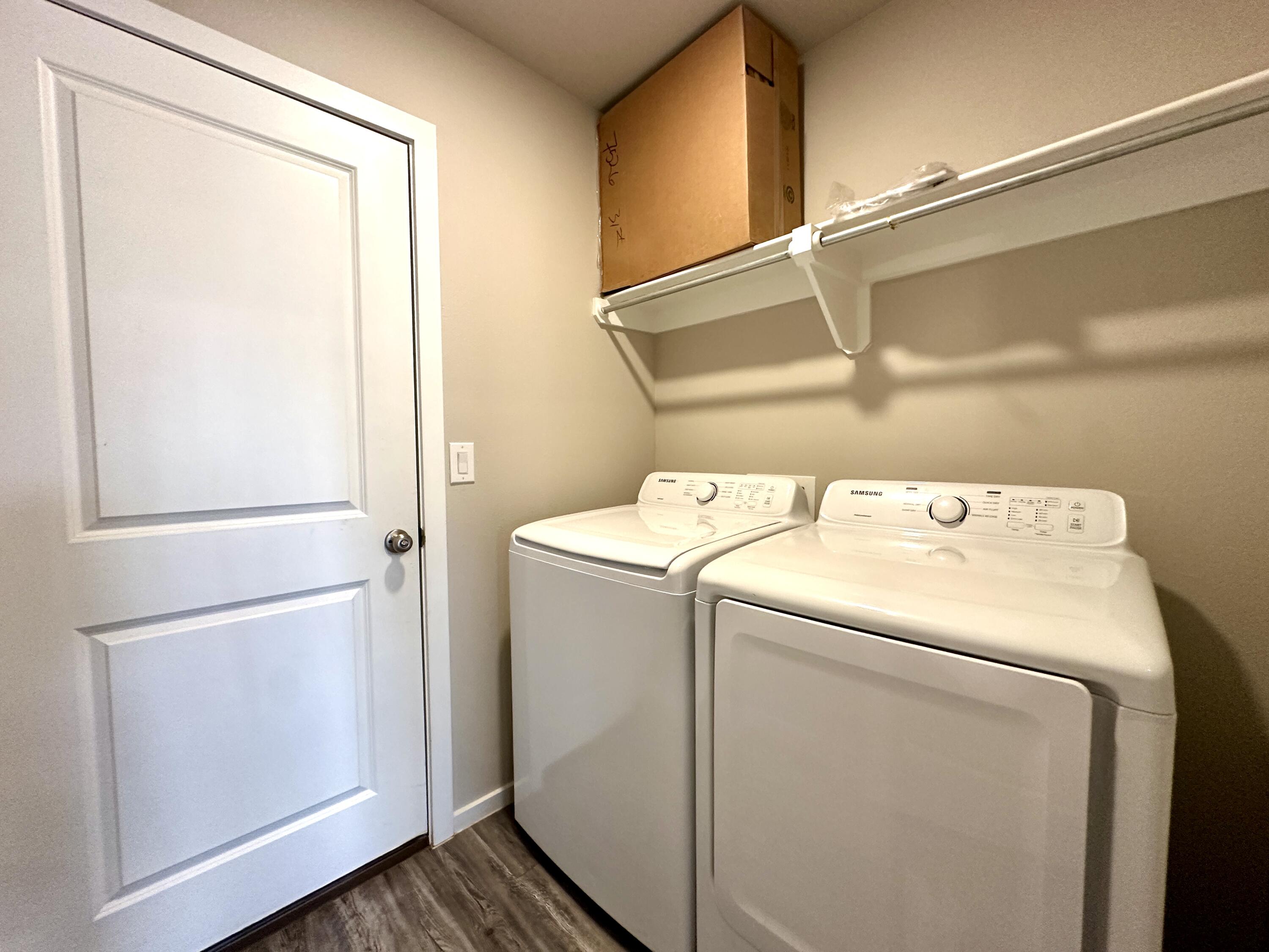 7526 31st Place Lubbock, TX 79407 - Photo 7 of 14 a utility room with dryer and washer
