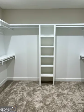 a view of an empty room with empty racks