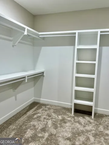 a view of an empty room with empty racks