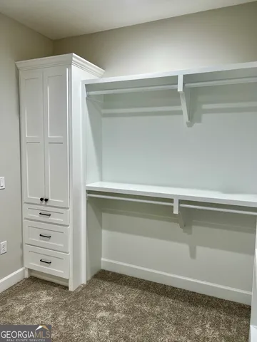 a view of an empty walk in closet