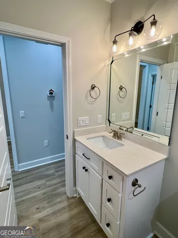 a bathroom with a double vanity sink and mirror