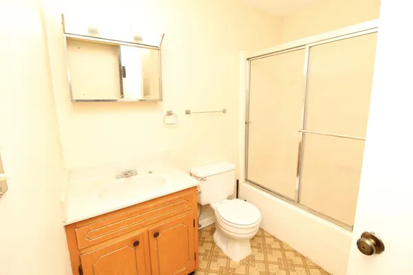 a bathroom with a toilet a sink and a bathtub
