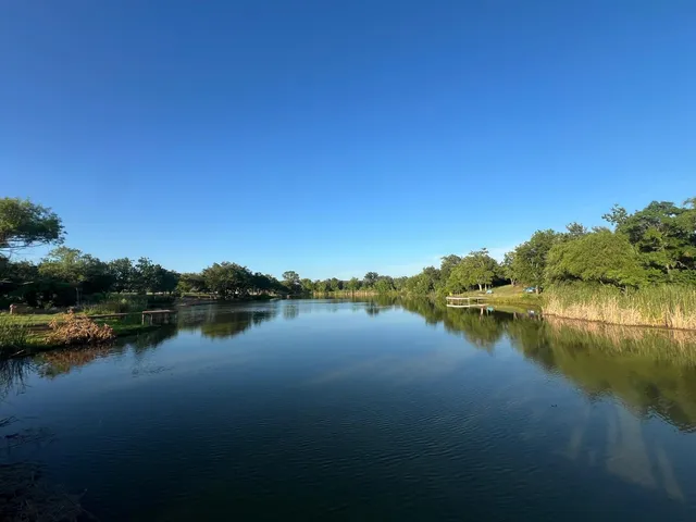 a view of lake with green space