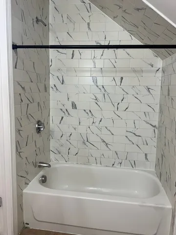 a bathroom with a bathtub