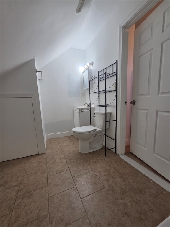 61 Crescent Avenue, Unit 2 Chelsea, MA 02150 - Photo 10 of 16 a bathroom with a sink toilet and vanity