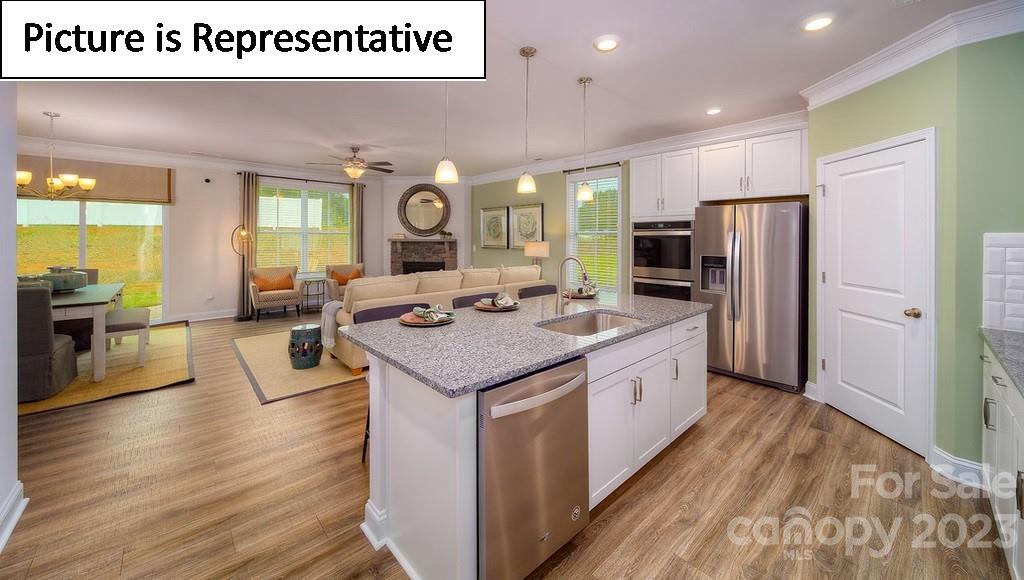 4182 Millstream Road Denver, NC 28037 - Photo 15 of 29 a large kitchen with stainless steel appliances kitchen island granite countertop a large counter top and stainless steel appliances