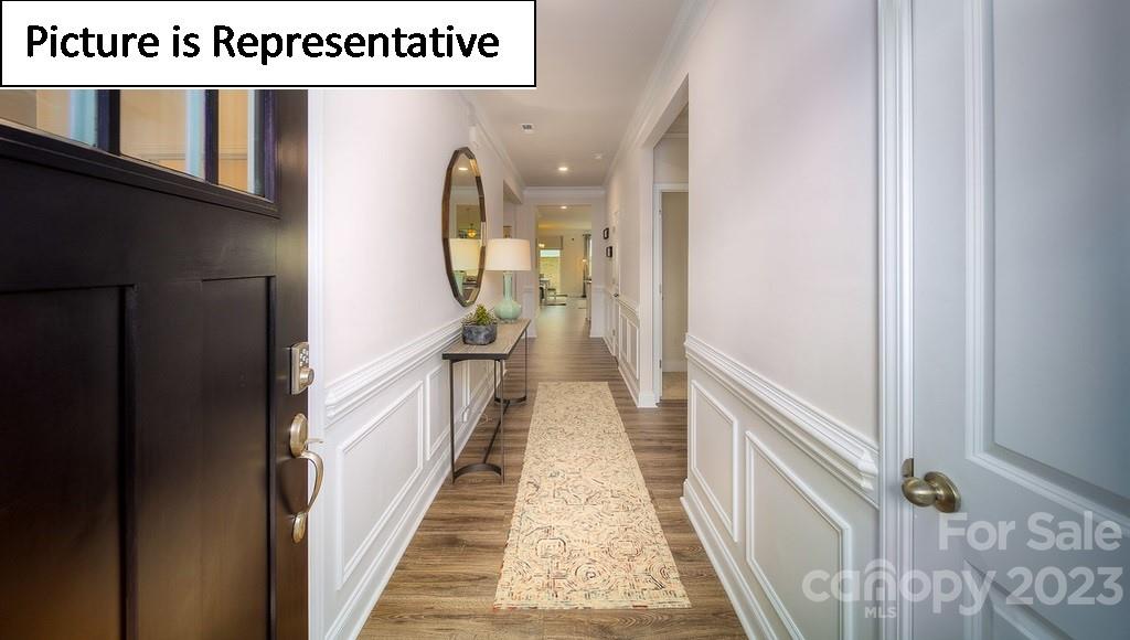 4182 Millstream Road Denver, NC 28037 - Photo 2 of 29 a view of a hallway with wooden floor and staircase