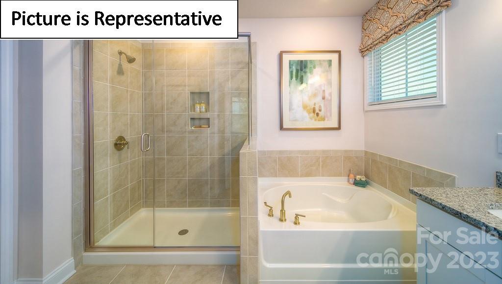 4182 Millstream Road Denver, NC 28037 - Photo 28 of 29 a white bath tub sitting next to a shower