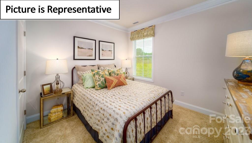 4182 Millstream Road Denver, NC 28037 - Photo 6 of 29 a bedroom with a bed and a table in it
