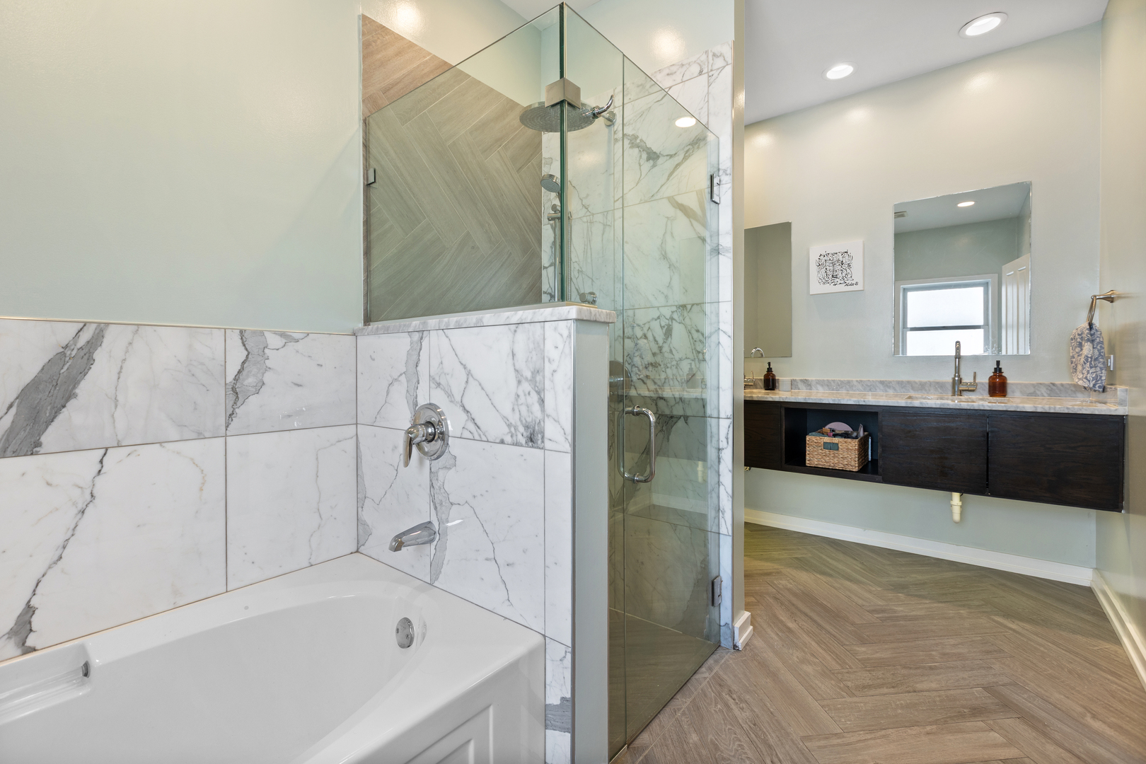 417 North Noble Street, Unit 5 Chicago, IL 60642 - Photo 12 of 15 a bathroom with a tub a sink shower and mirror
