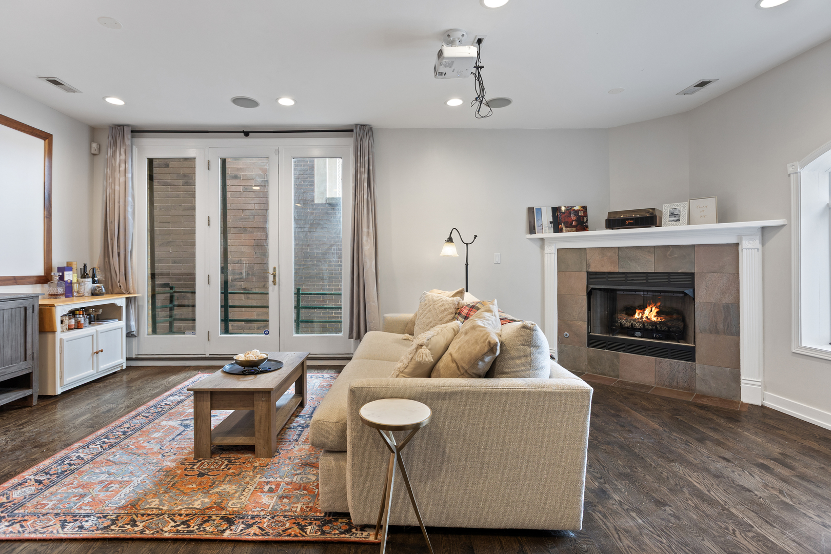 417 North Noble Street, Unit 5 Chicago, IL 60642 - Photo 7 of 15 a living room with furniture and a fireplace