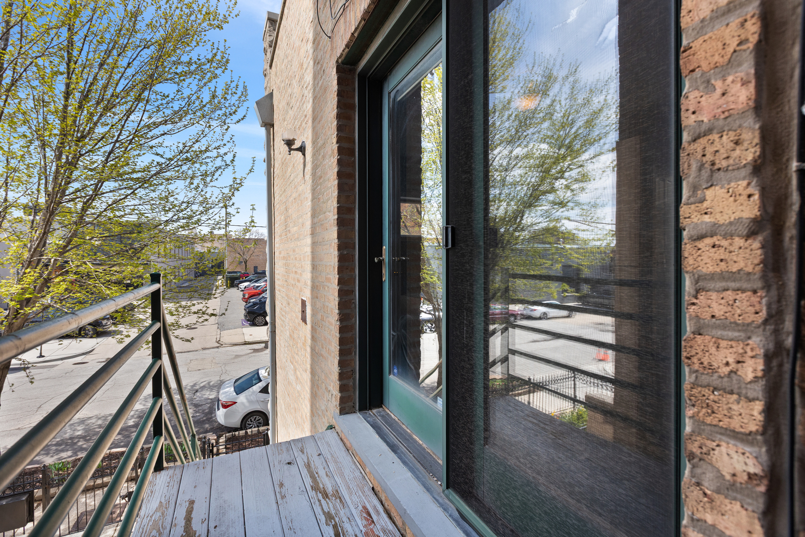 417 North Noble Street, Unit 5 Chicago, IL 60642 - Photo 9 of 15 a view of a balcony with wooden floor