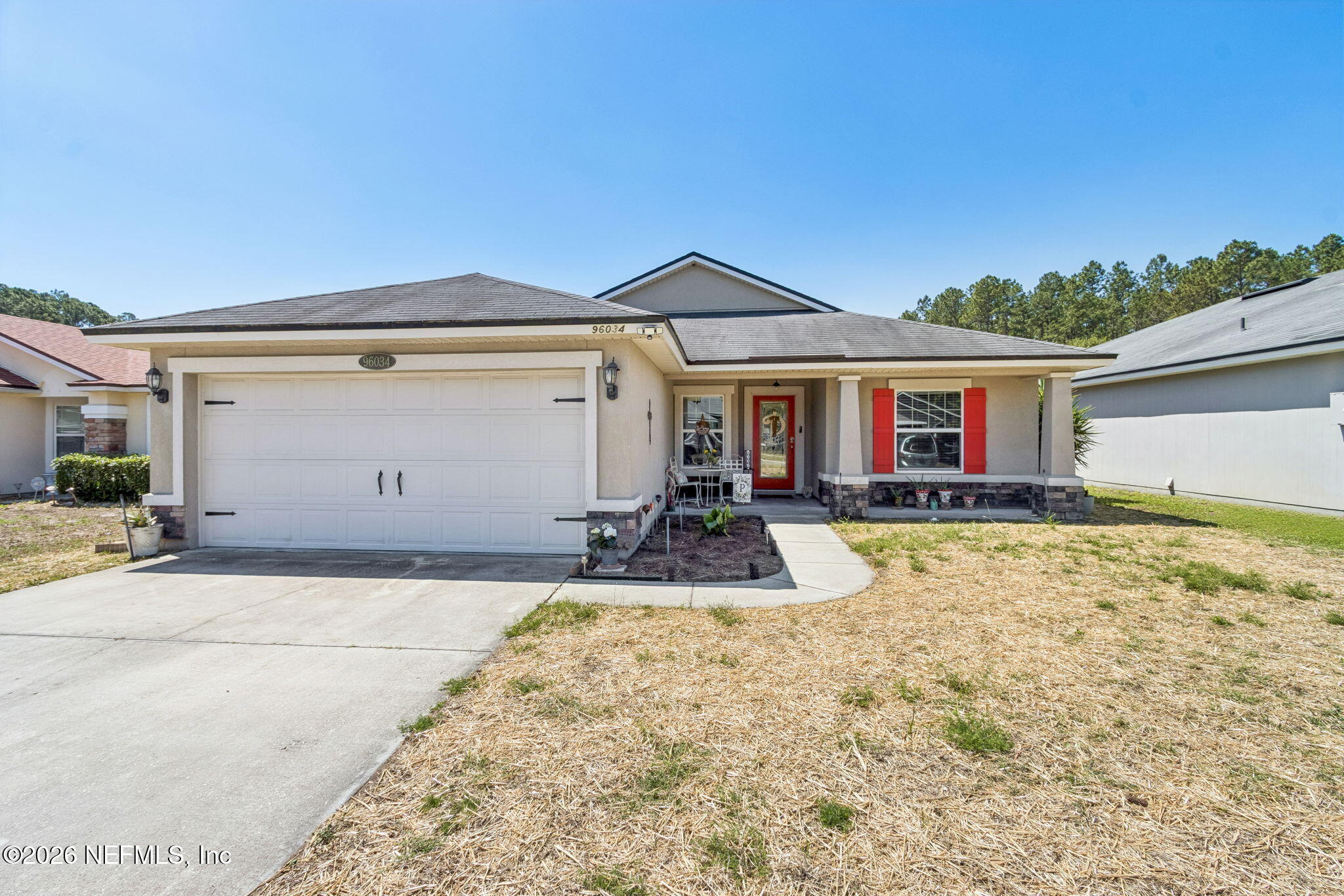 96034 Bass Lane Yulee, FL 32097 - Photo 5 of 50 a view of a house with basketball court