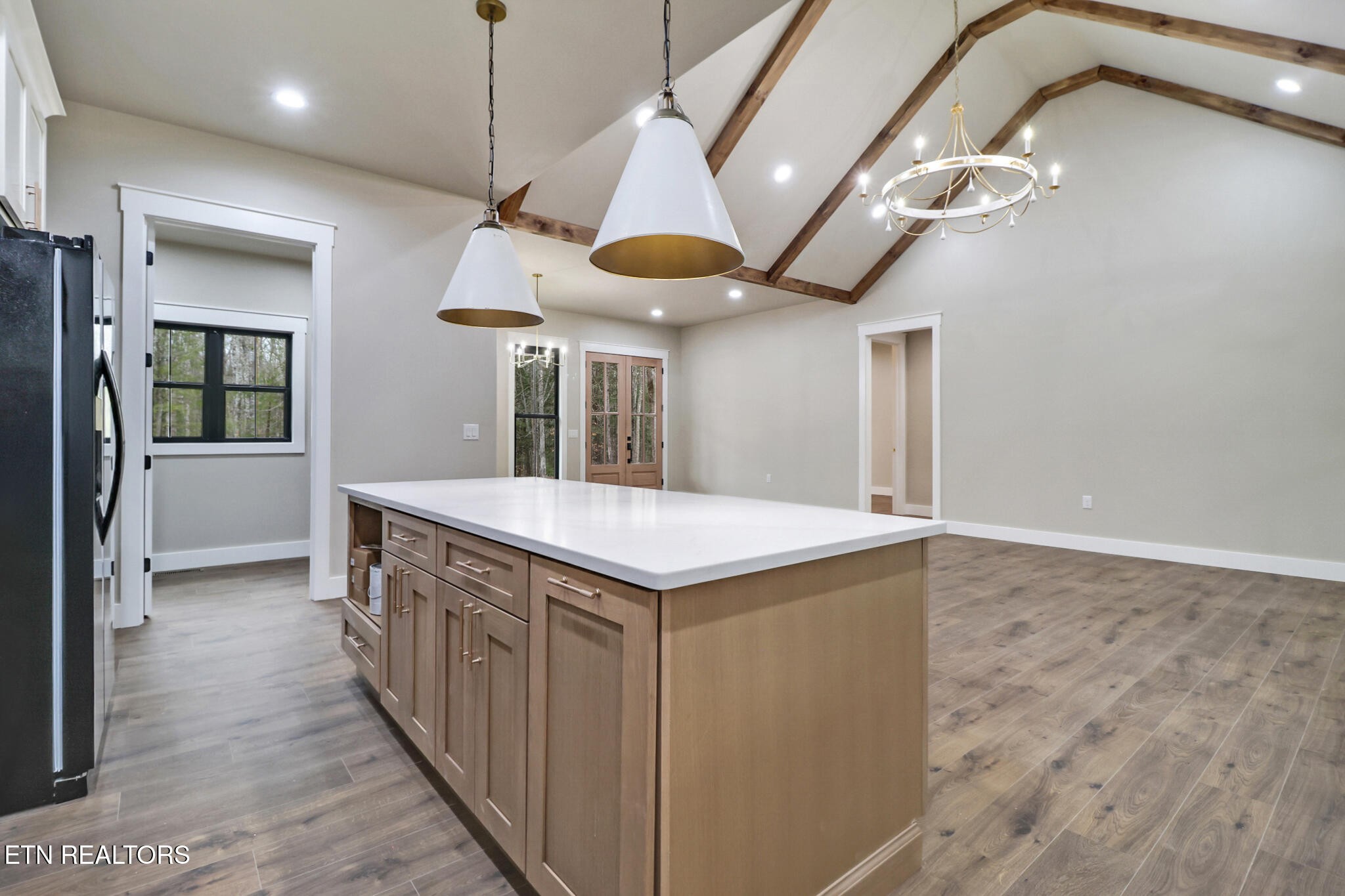 1440 Model Farm Road Jamestown, TN 38556 - Photo 17 of 35 a kitchen with a stove a refrigerator and a chandelier