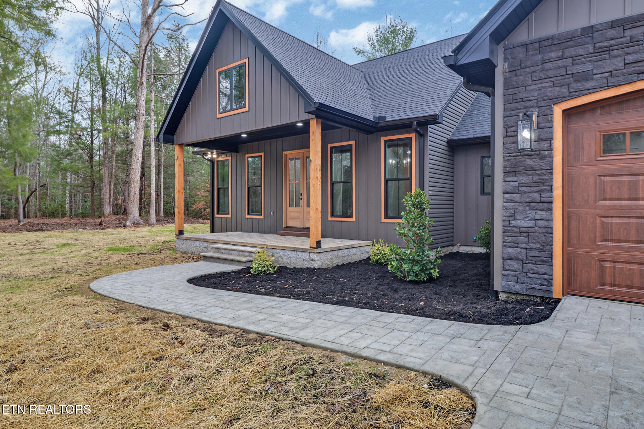 1440 Model Farm Road Jamestown, TN 38556 - Photo 2 of 35 a front view of a house with garden