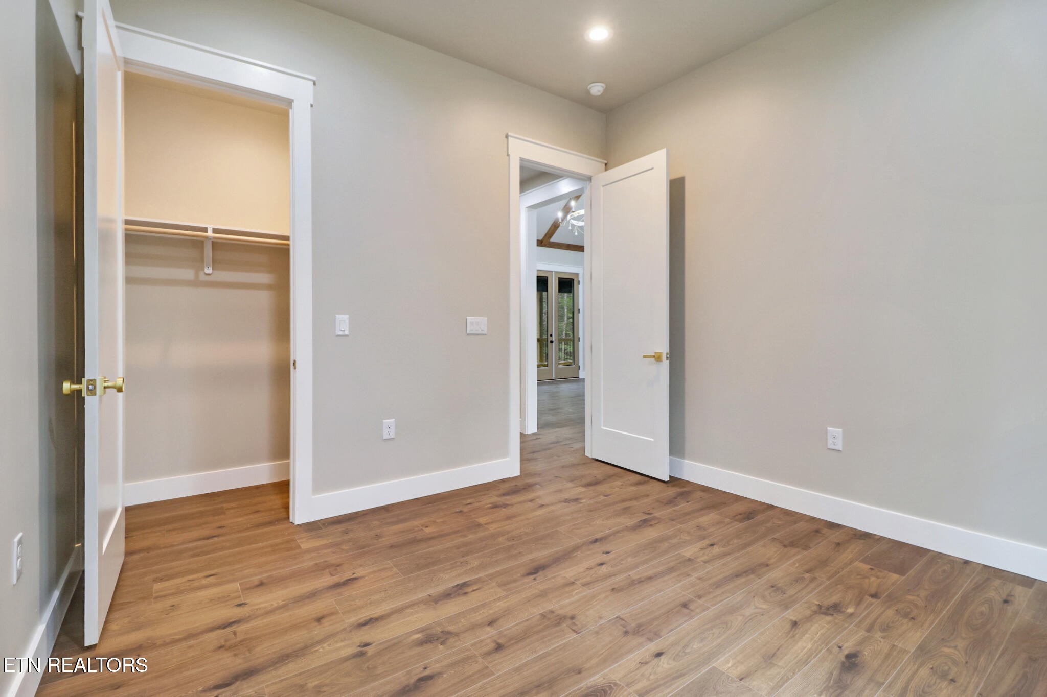 1440 Model Farm Road Jamestown, TN 38556 - Photo 24 of 35 a view of an empty room with wooden floor