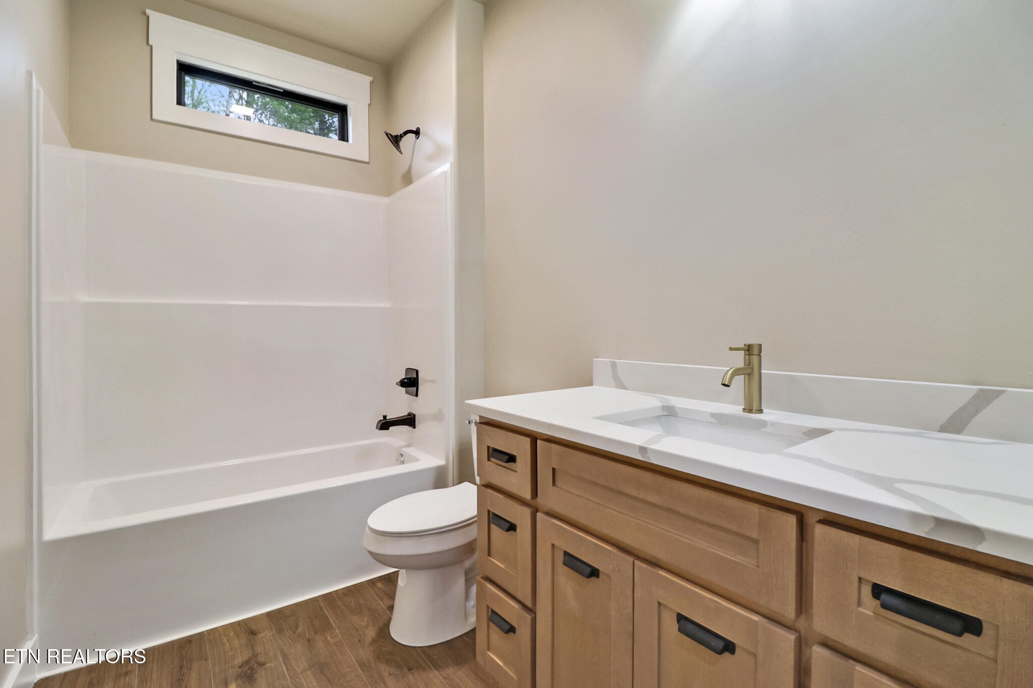 1440 Model Farm Road Jamestown, TN 38556 - Photo 25 of 35 a bathroom with a granite countertop sink toilet and shower