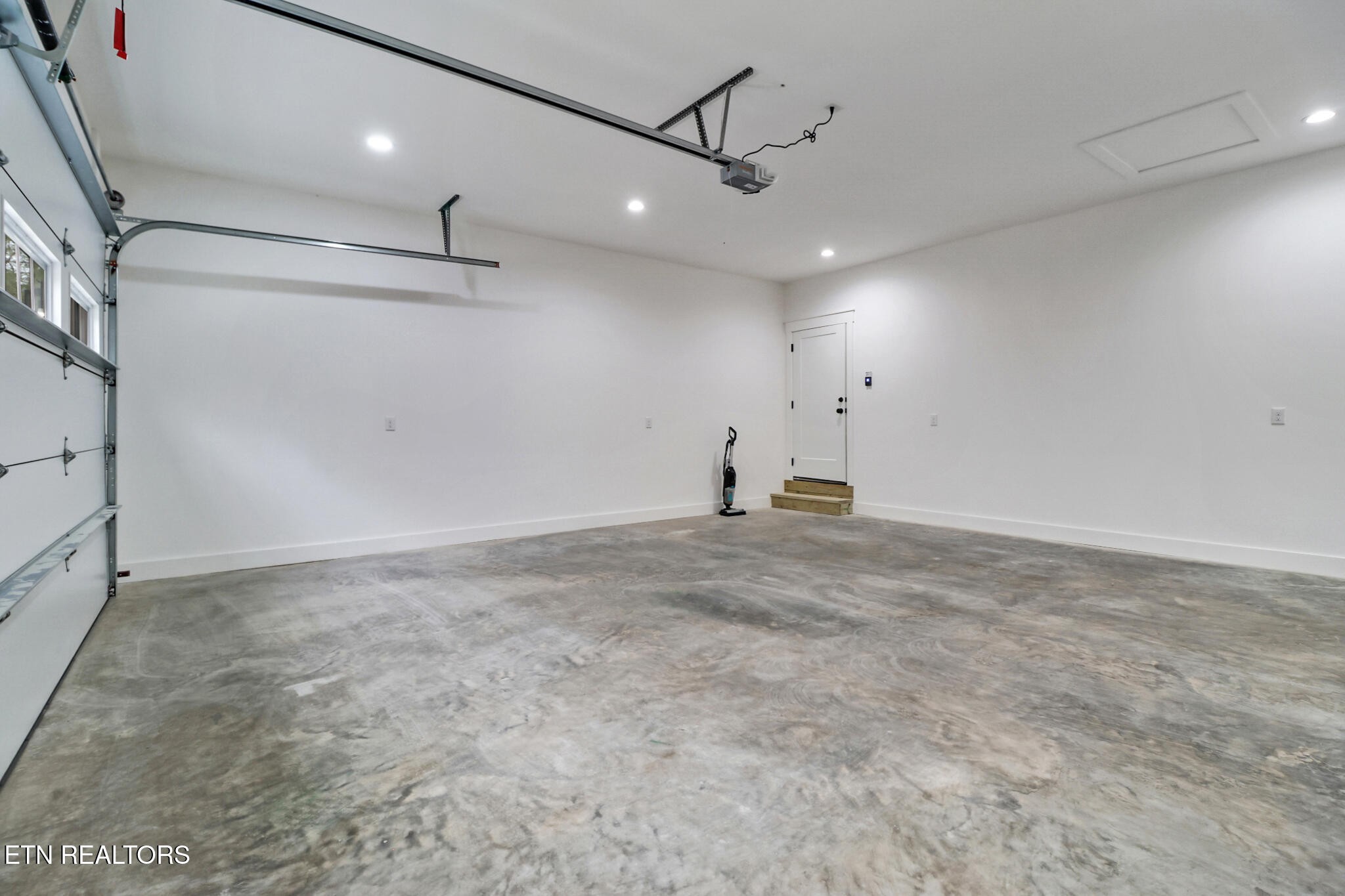 1440 Model Farm Road Jamestown, TN 38556 - Photo 32 of 35 a view of a big room with wooden floor and windows