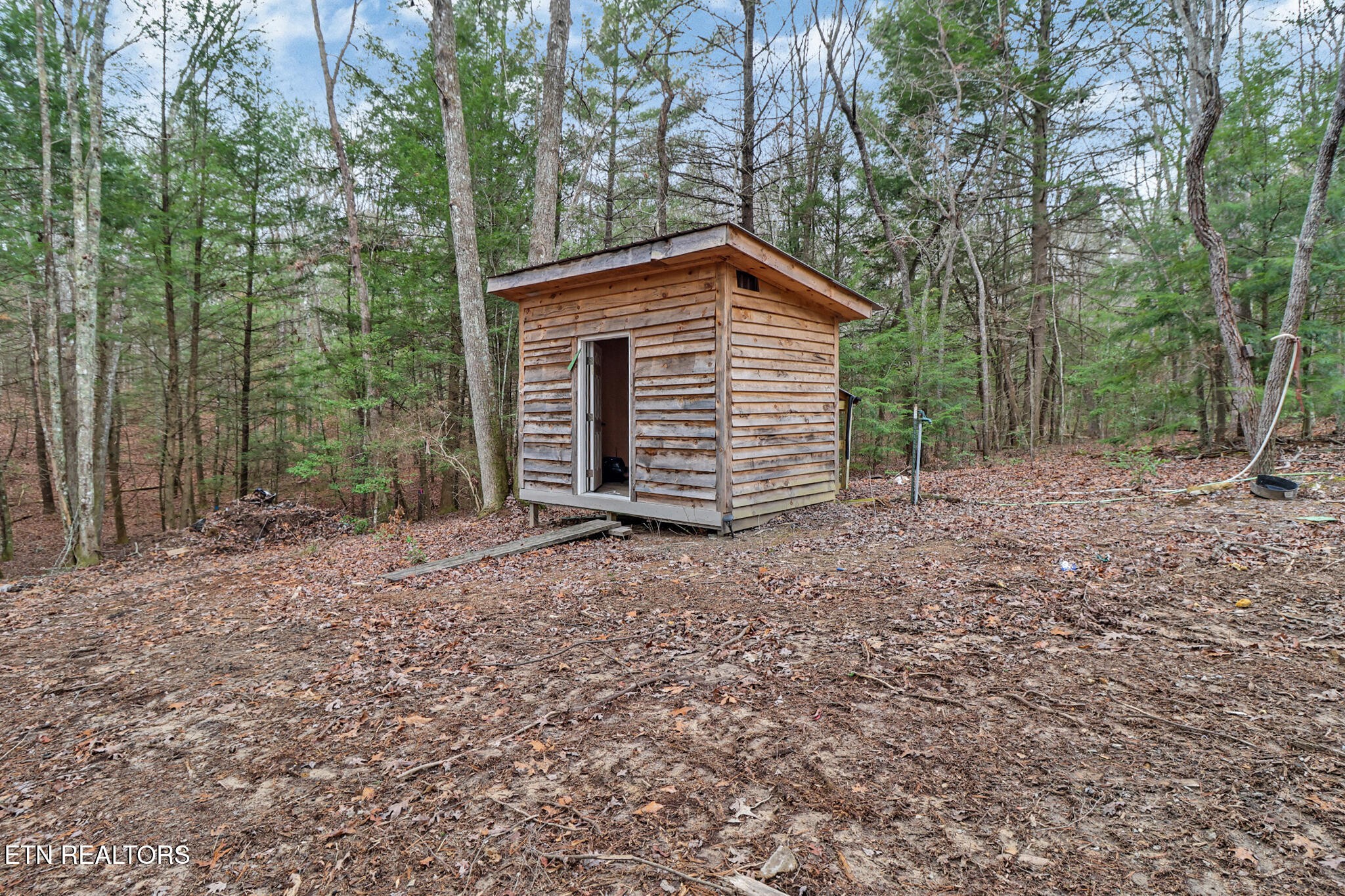 1440 Model Farm Road Jamestown, TN 38556 - Photo 33 of 35 a view of a house with a backyard