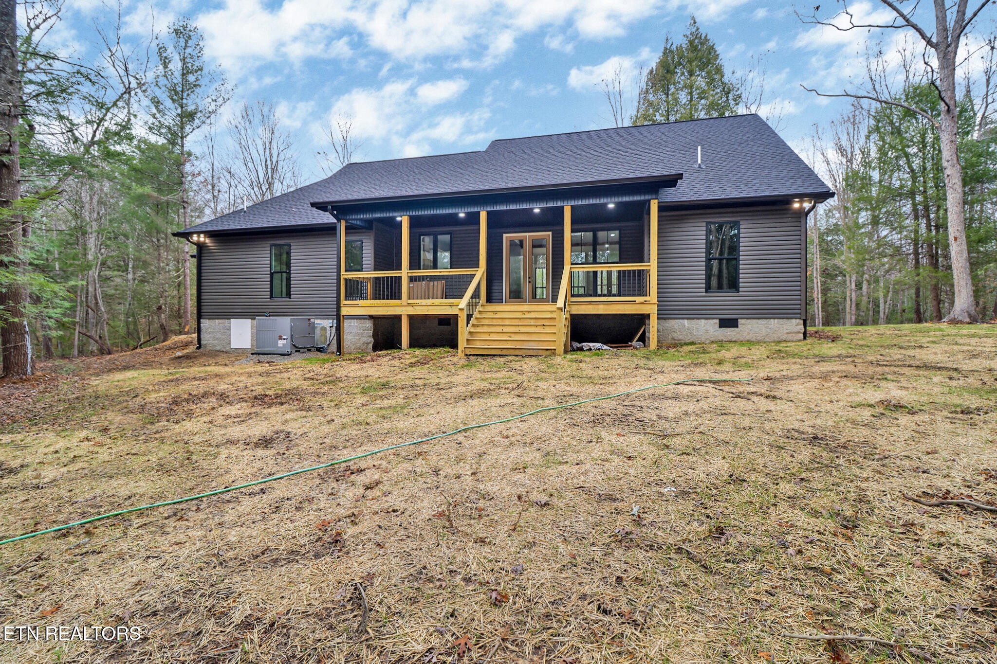 1440 Model Farm Road Jamestown, TN 38556 - Photo 7 of 35 a house with yard in front of it