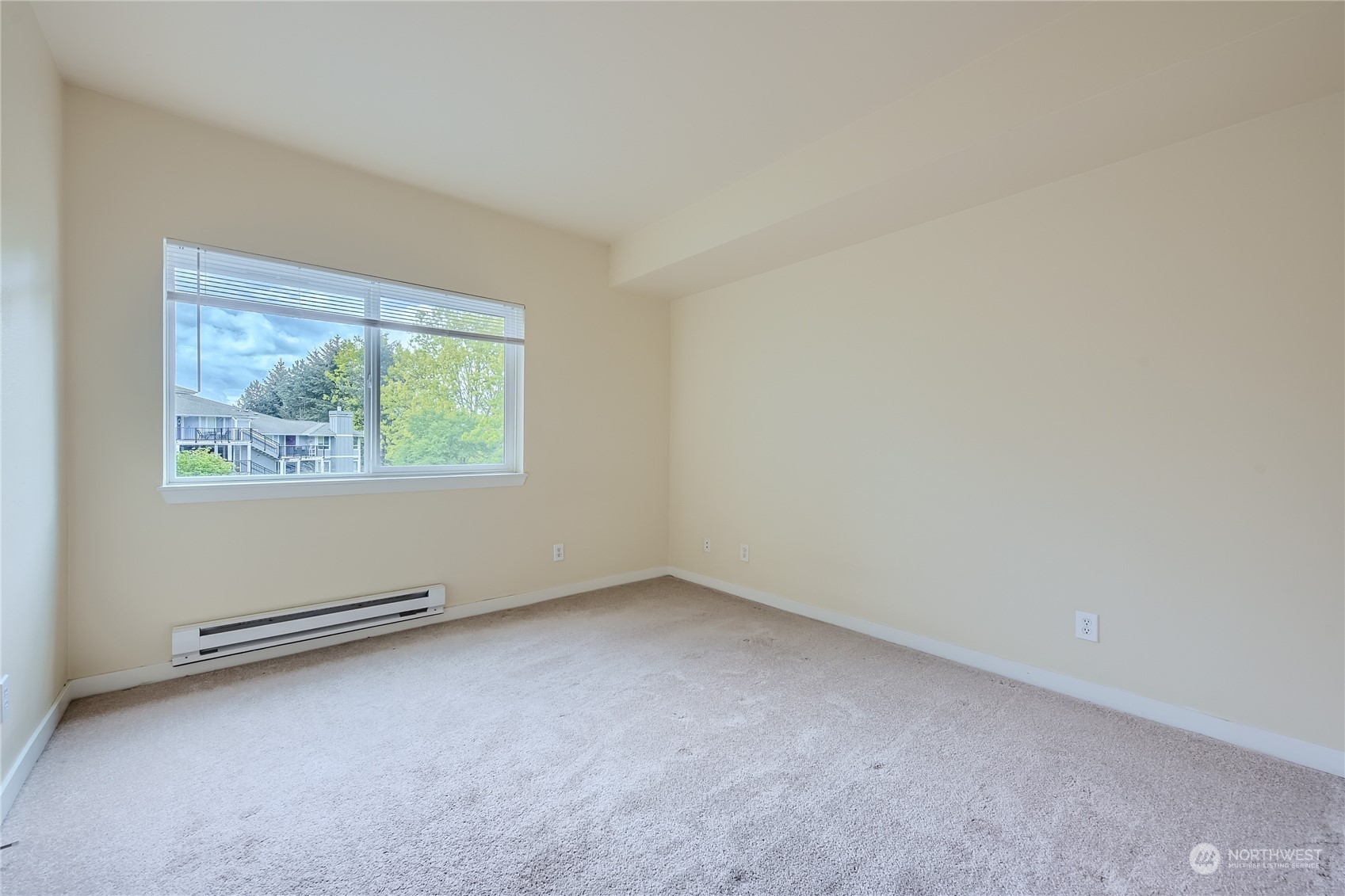 3901 243rd Place Southeast, Unit O203 Bothell, WA 98021 - Photo 8 of 11 an empty room with windows