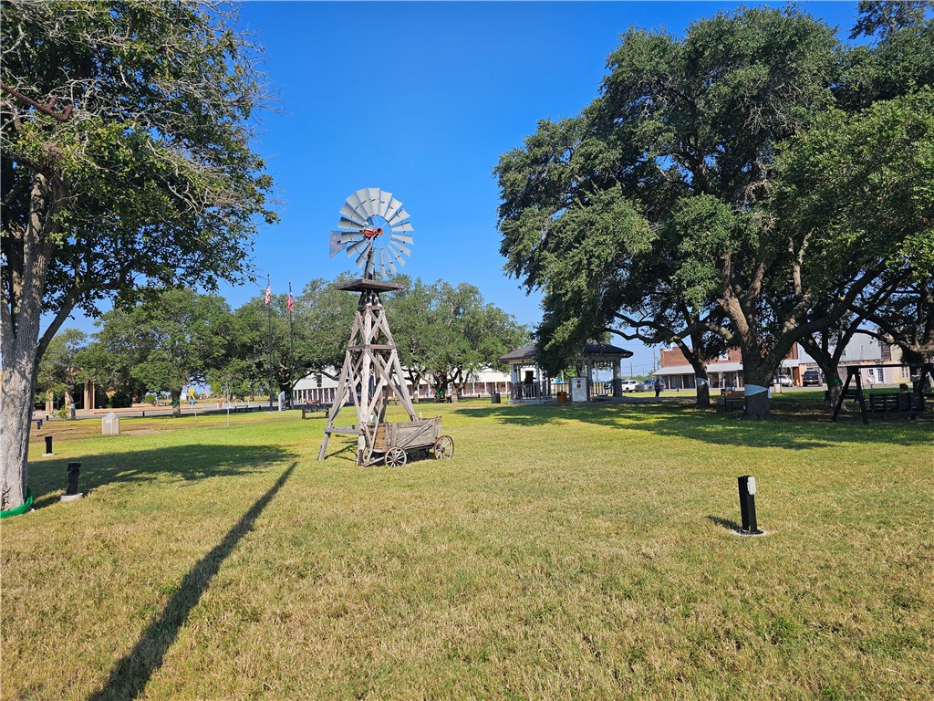 1300 Johnson Street, Unit 1A Woodsboro, TX 78393 - Photo 2 of 2 a view of a playground with a slide