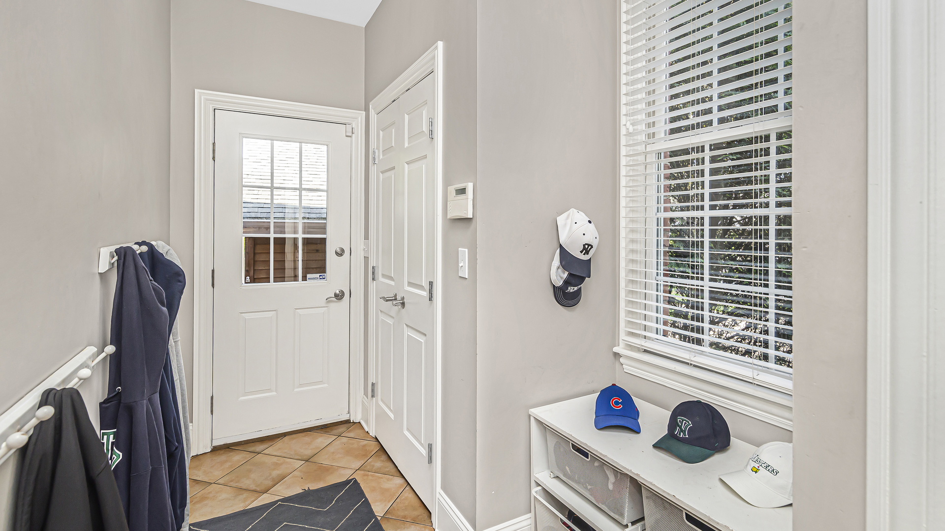 300 Walnut Street Winnetka, IL 60093 - Photo 14 of 28 a view of walk in closet with clothes and shoes