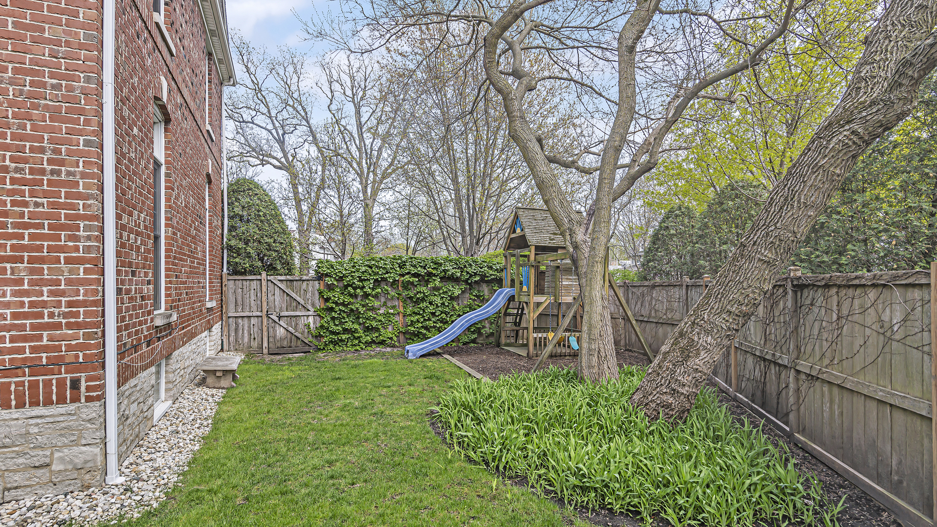 300 Walnut Street Winnetka, IL 60093 - Photo 26 of 28 a view of a pathway of a wooden house with large trees