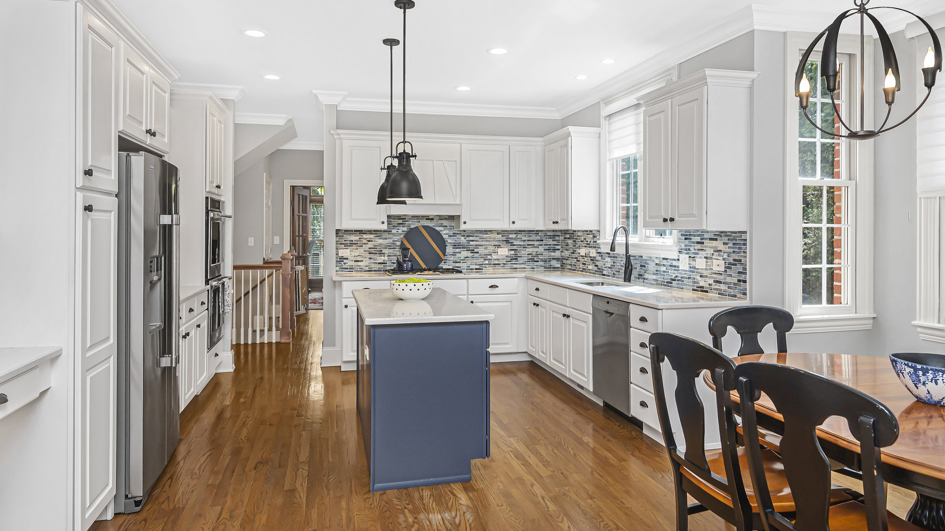 300 Walnut Street Winnetka, IL 60093 - Photo 7 of 28 a kitchen with stainless steel appliances kitchen island granite countertop a stove a sink and a refrigerator