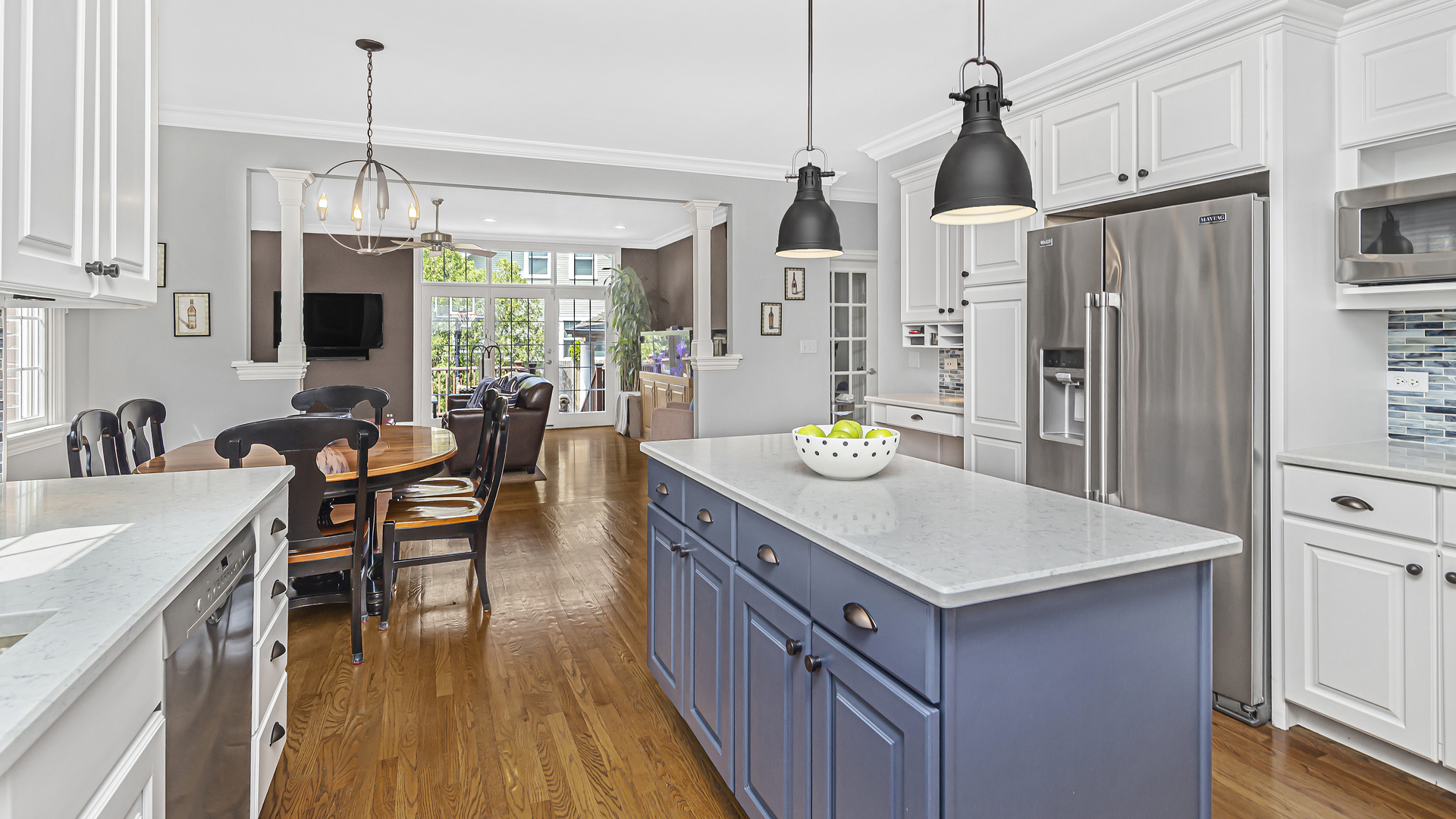 300 Walnut Street Winnetka, IL 60093 - Photo 8 of 28 a kitchen with stainless steel appliances granite countertop a sink stove and refrigerator with wooden floor
