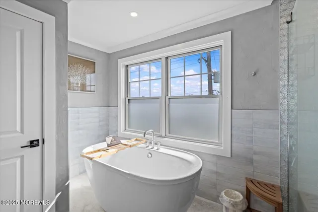 a bathroom with a toilet a sink and shower