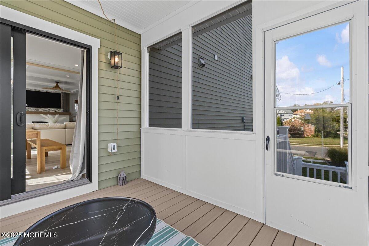 1608 East Street Point Pleasant Beach, NJ 08742 - Photo 22 of 51 a view of a balcony with wooden floor and front door