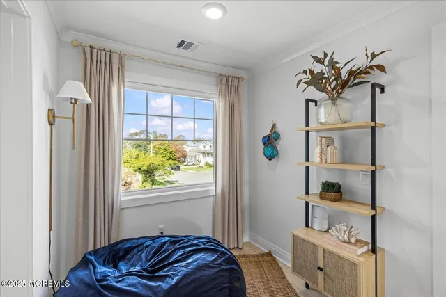 a bedroom with bed and a window