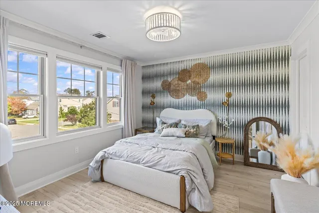 a bedroom with a bed and window