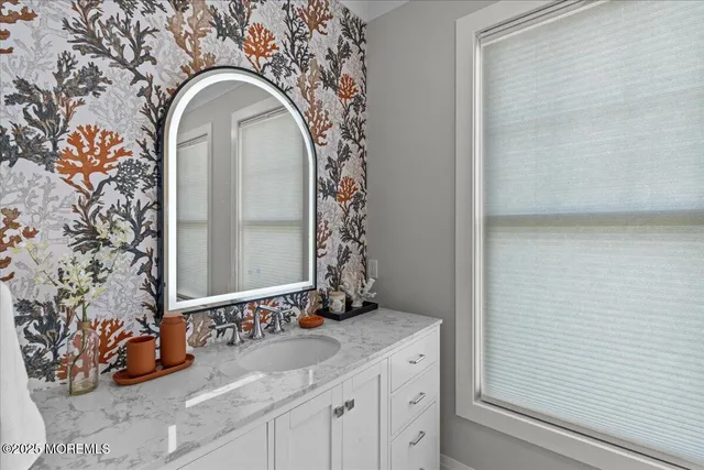 a white toilet sitting next to a shower curtain