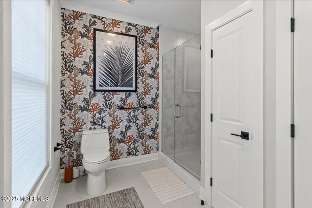 a view of a balcony with wooden floor and front door