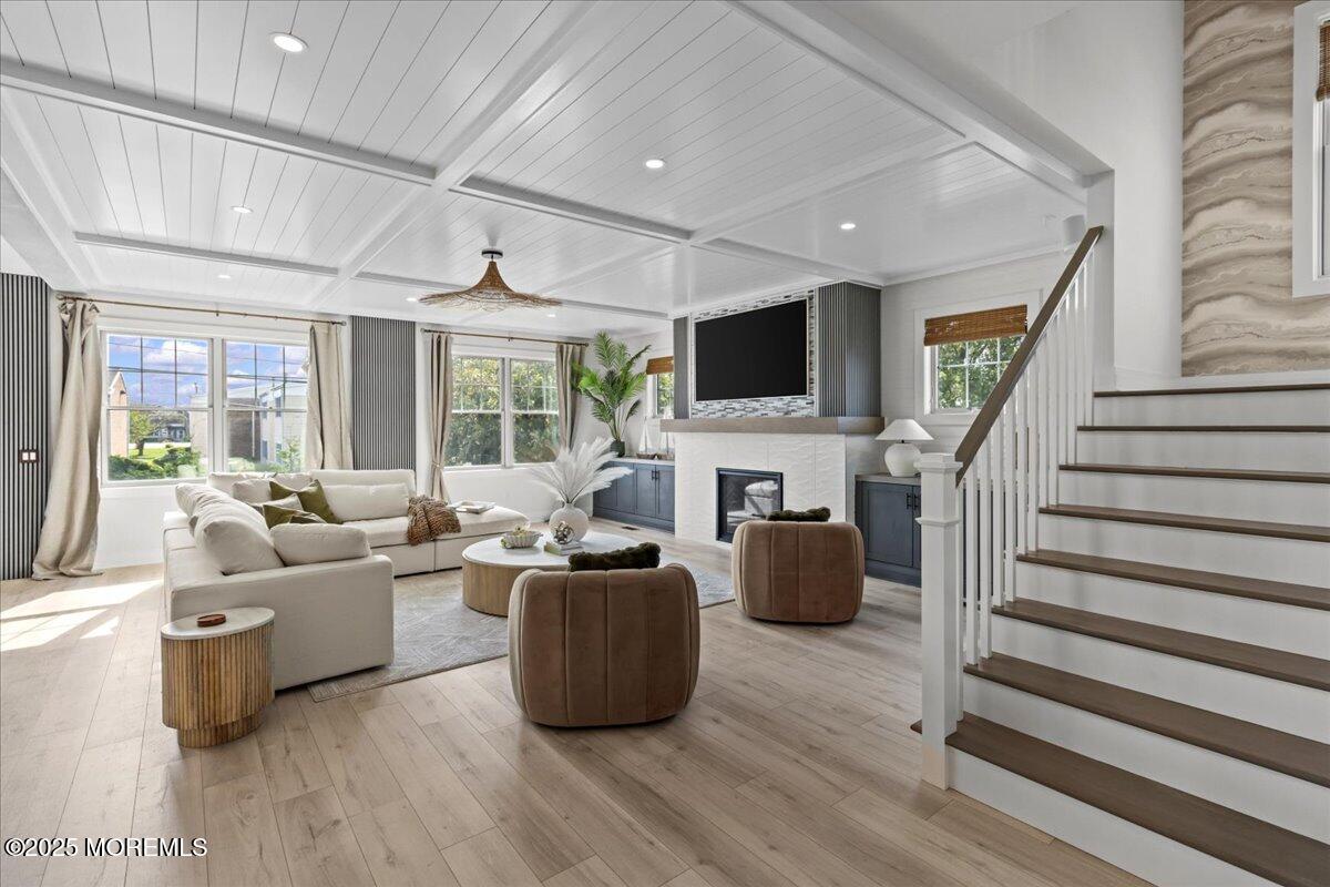 1608 East Street Point Pleasant Beach, NJ 08742 - Photo 37 of 51 a living room with furniture a fireplace and a flat screen tv