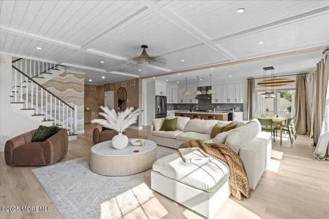 a living room with fireplace furniture and a flat screen tv