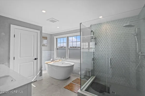 a living room with a bed furniture and a large window