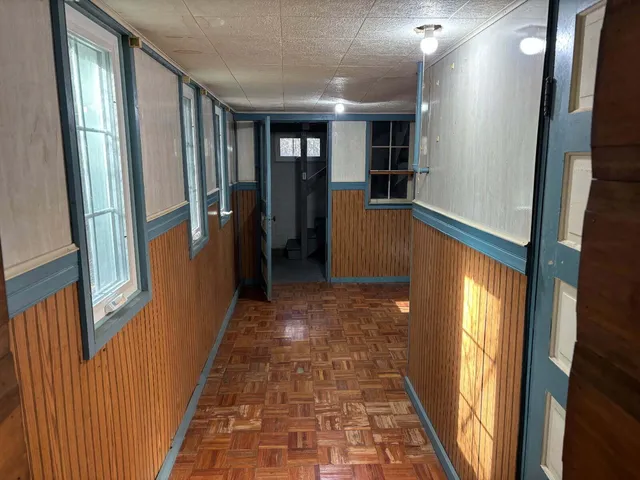 a view of gallery with windows