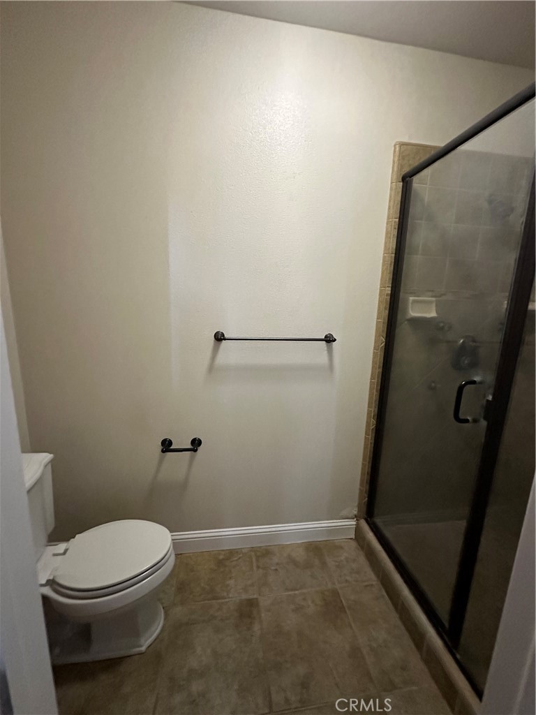 3119 Lorrie Court Merced, CA 95348 - Photo 17 of 38 a white toilet sitting next to a sink