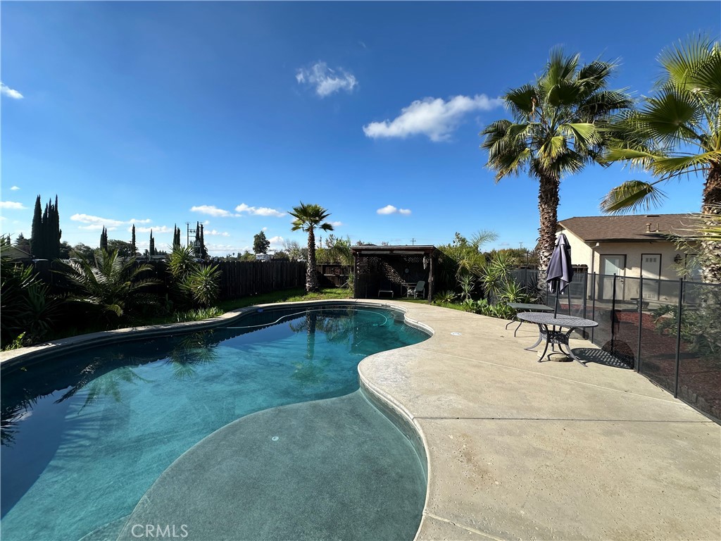 3119 Lorrie Court Merced, CA 95348 - Photo 30 of 38 a swimming pool view with a garden space