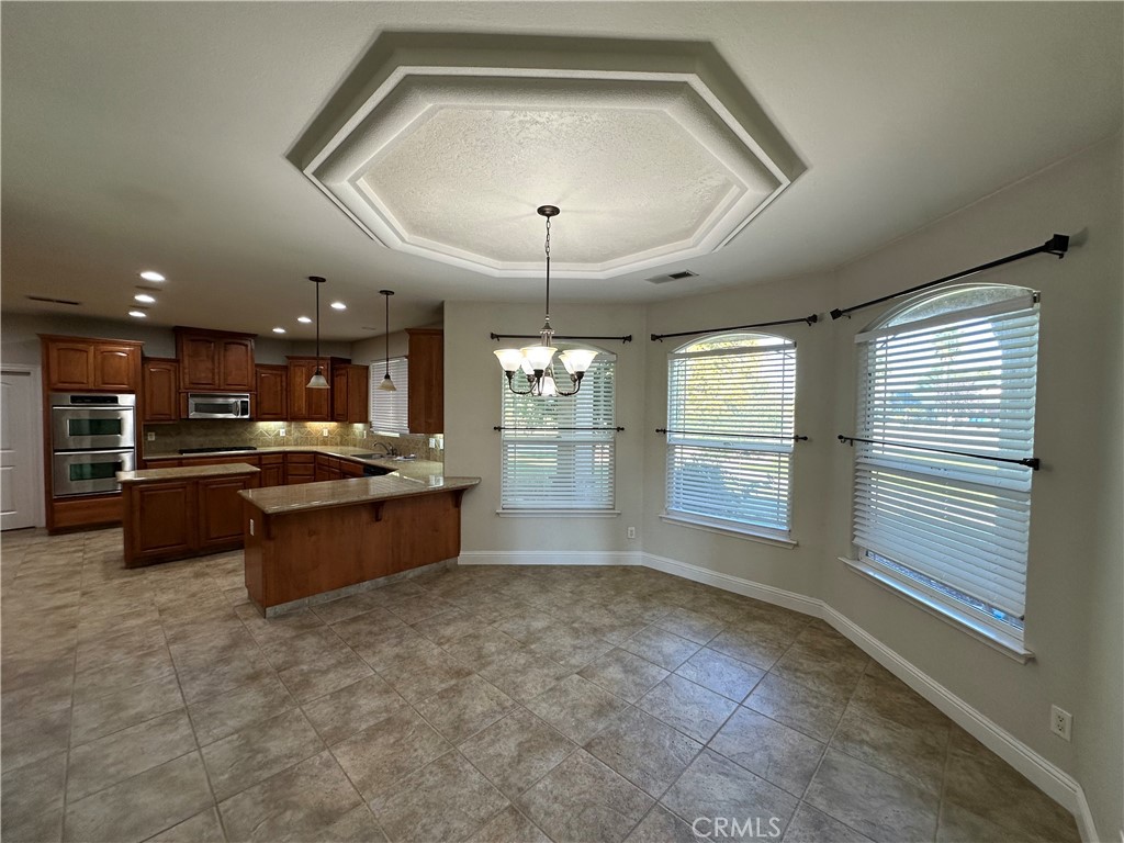 3119 Lorrie Court Merced, CA 95348 - Photo 9 of 38 a large living room with a large window