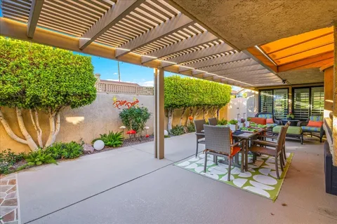 a outdoor living space with furniture and a potted plant