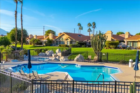 a childrens park with lots of swings and slides
